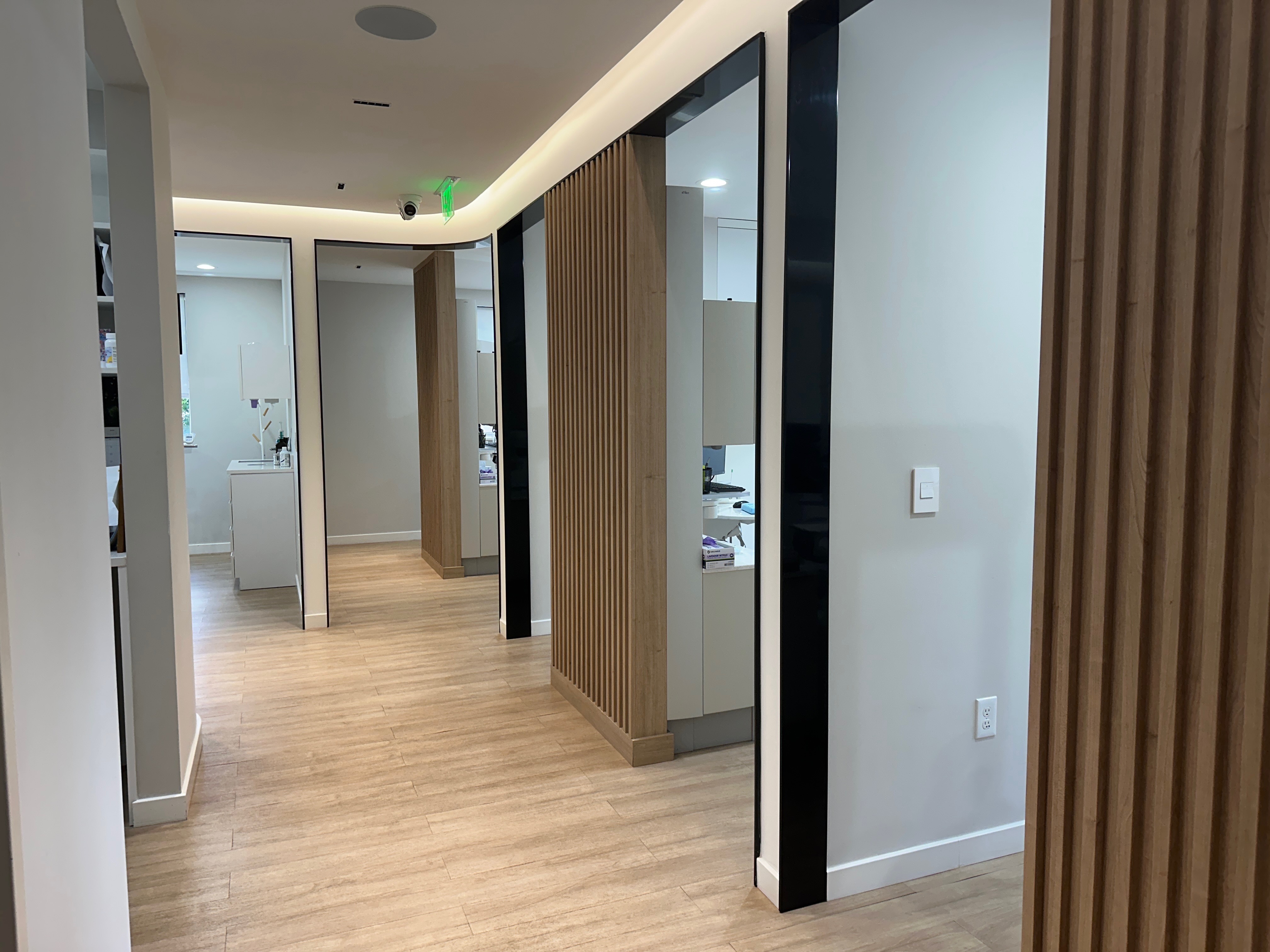 Modern treatment suite with overhead monitor